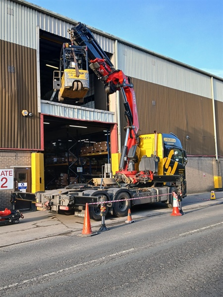 Removal of forklift truck and 1.4T machine from second floor building
